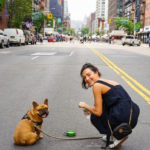 woman and her dog in the city