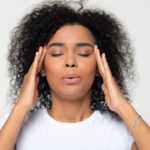 stressed BIPOC woman wondering if she should try adaptogens