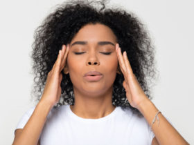 stressed BIPOC woman wondering if she should try adaptogens