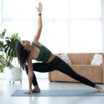 woman doing yoga from home