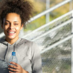 happy smiling young bipoc woman continuing to pursue her goals and not give up