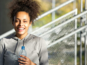 happy smiling young bipoc woman continuing to pursue her goals and not give up