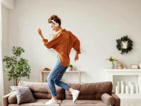 moving meditation. Happy young woman dances in her living room.