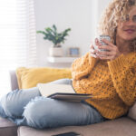 happy woman drinking tea connected to intuition