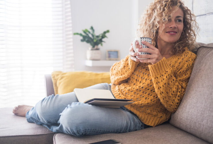 happy woman drinking tea connected to intuition