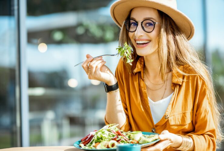 woman eating salad