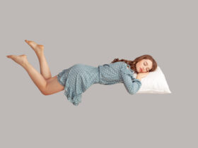 Pretty young woman sleeping on pillow in vintage dress