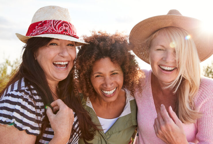 Three women in their 40s friends hiking together